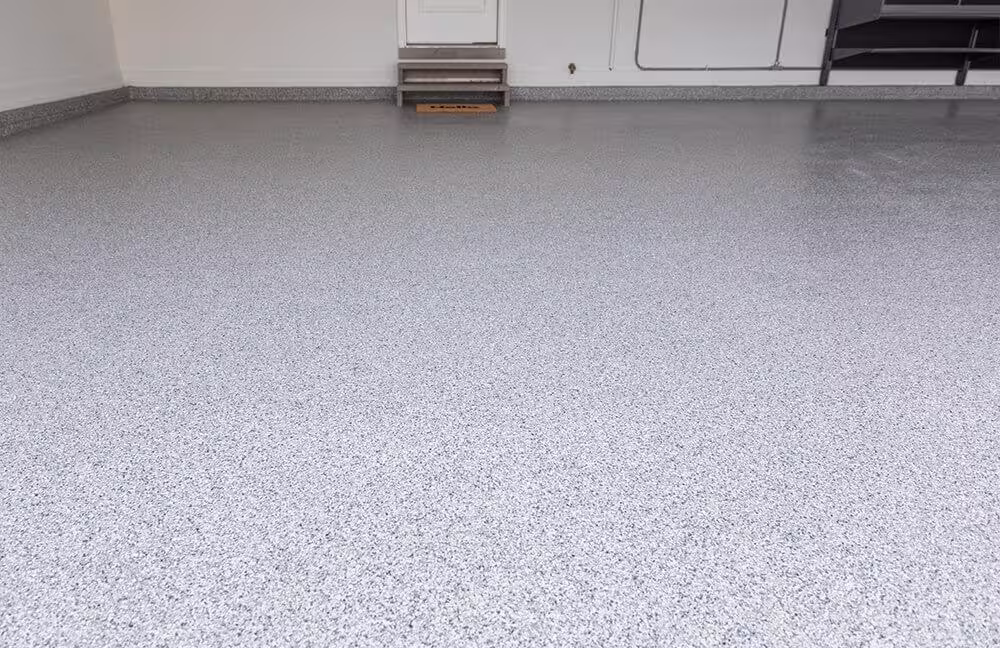 Concrete garage floor after application of a polyurea protective coating.